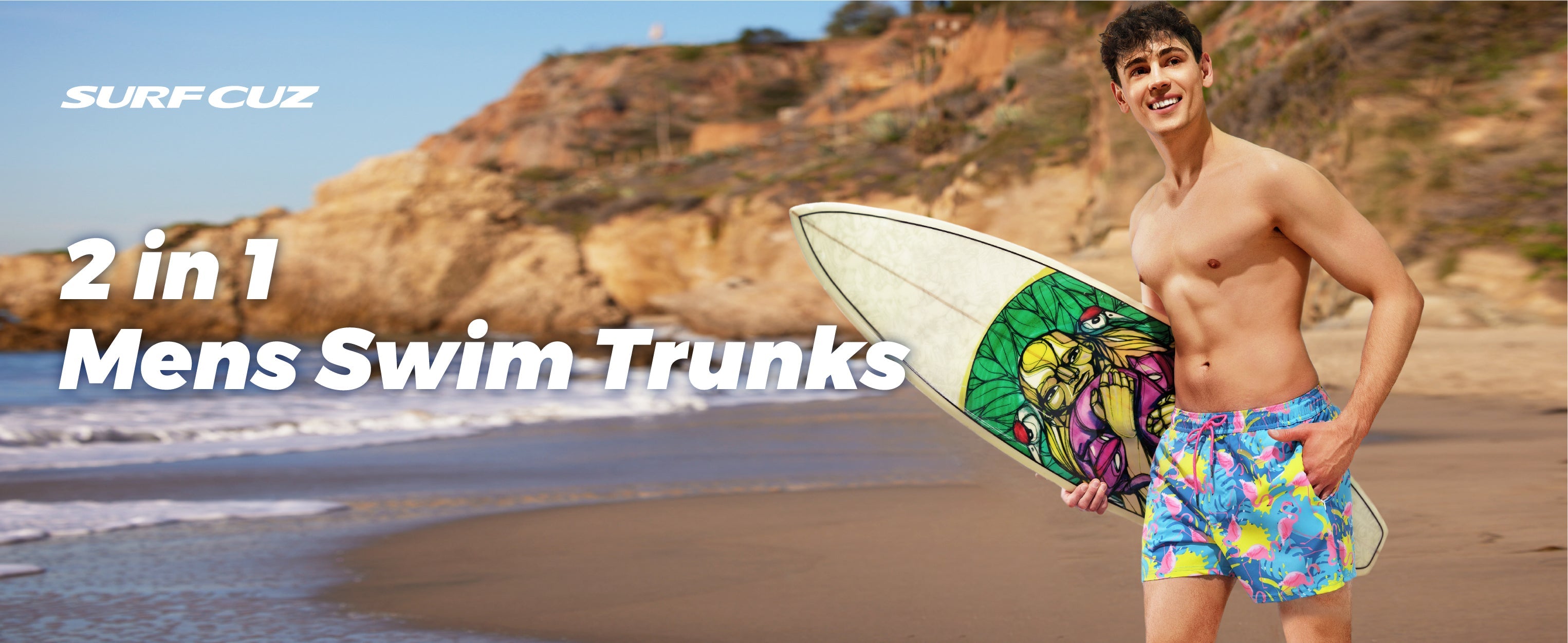Man wearing black men's 2 in 1 swim shorts standing on a beach with waves in the background