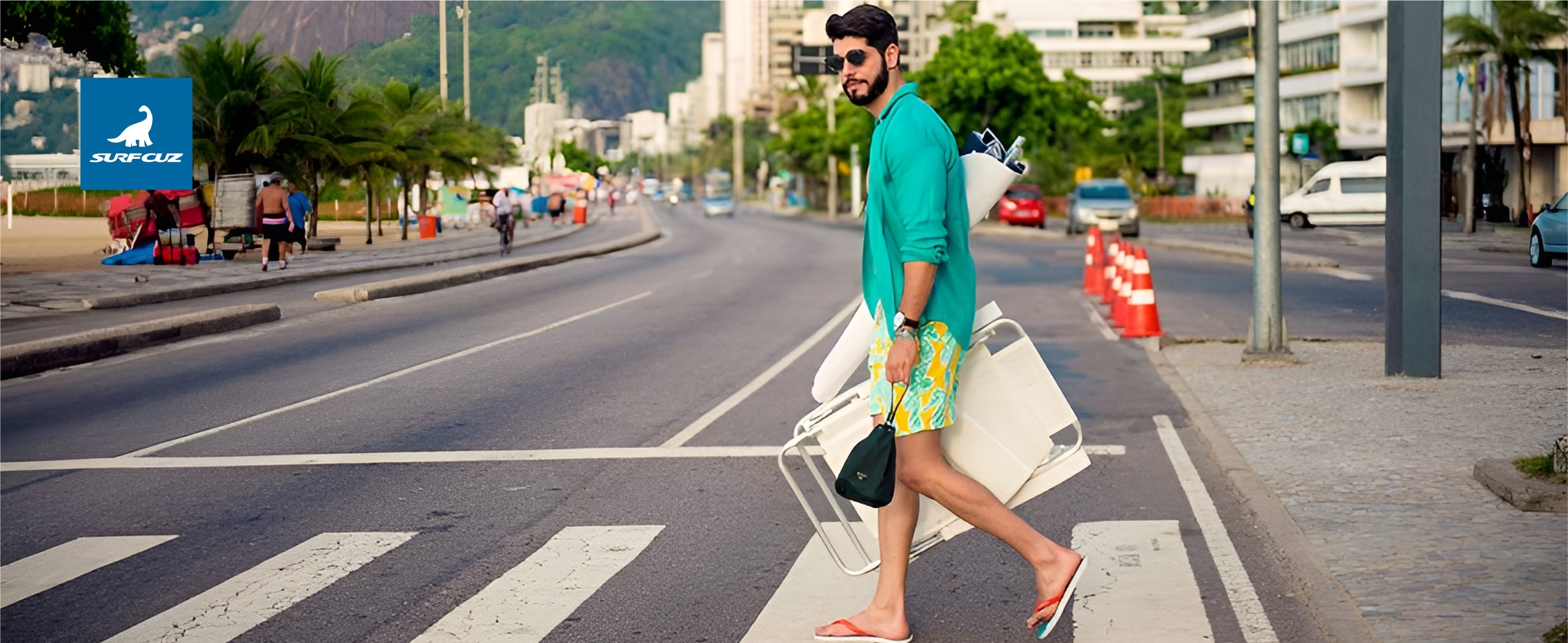 Man wearing men's 2 in 1 swim shorts while on a tropical vacation, walking from the beach to a resort