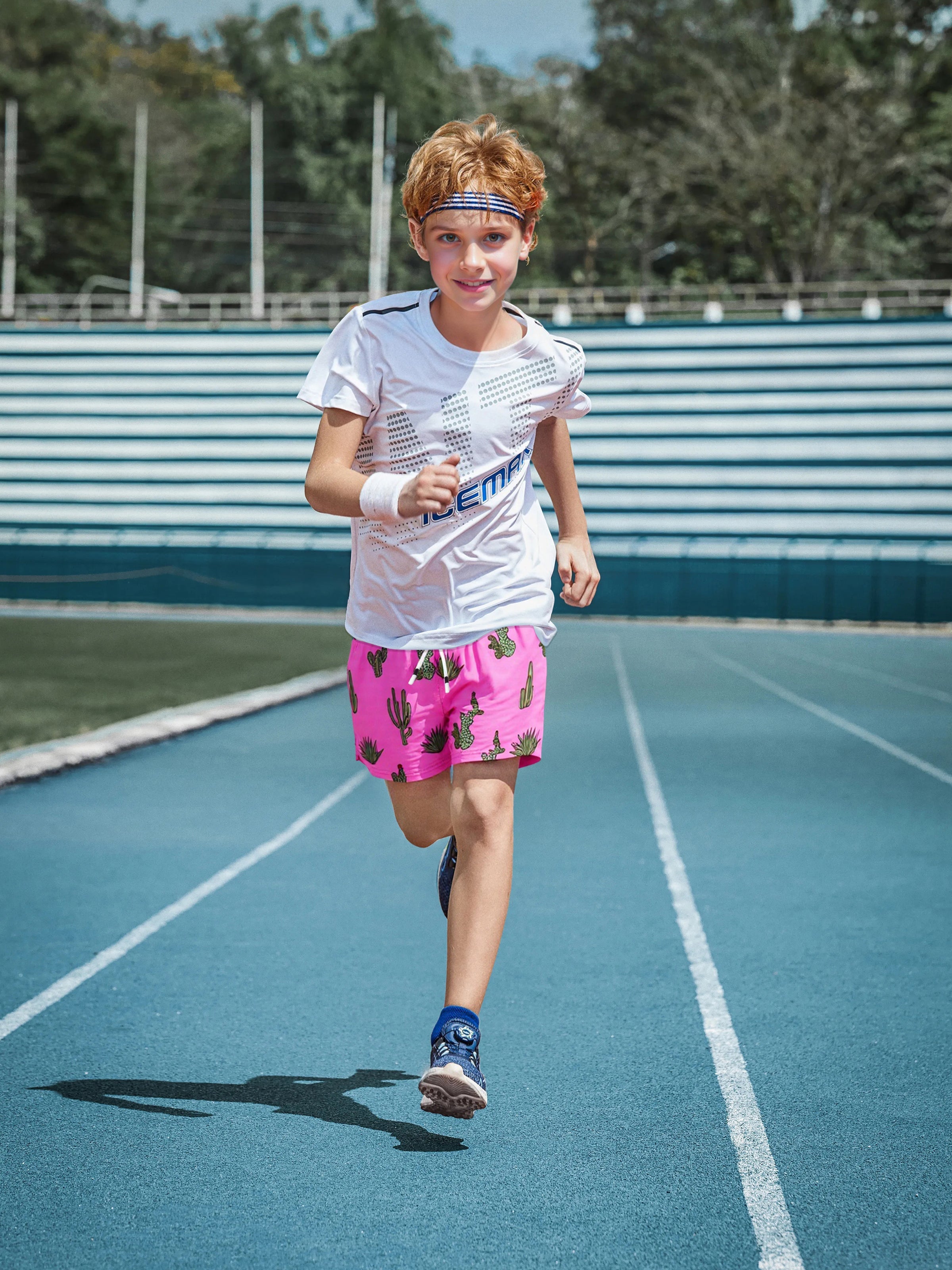 Boy on family vacation wearing Surfcuz boys beach shorts — lightweight, stylish, and perfect for swimming, sightseeing, and summer fun