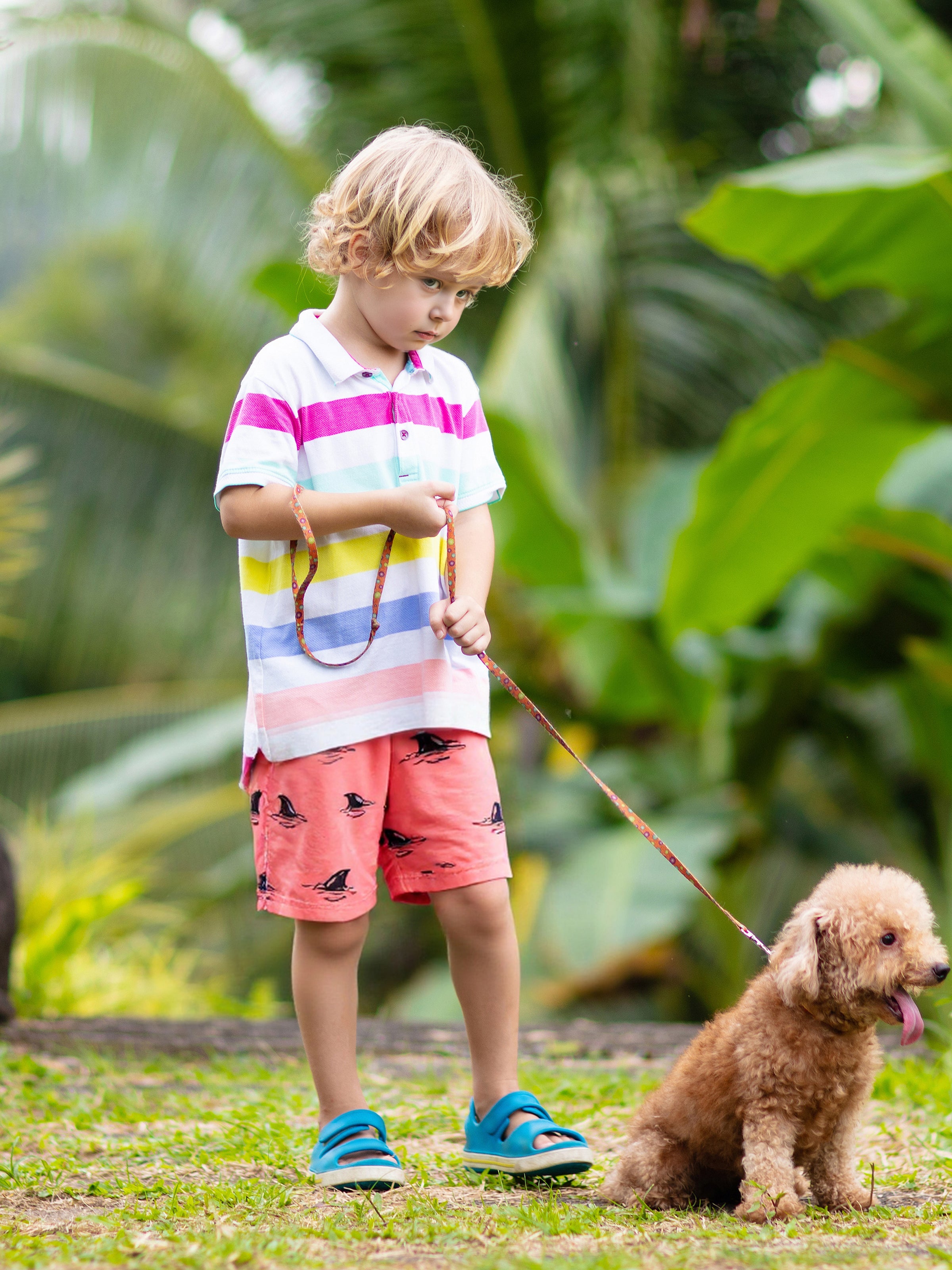 Boys playing beach soccer in Surfcuz swim trunks — quick-dry, 4-way stretch shorts perfect for sports, swimming, and holiday fun.
