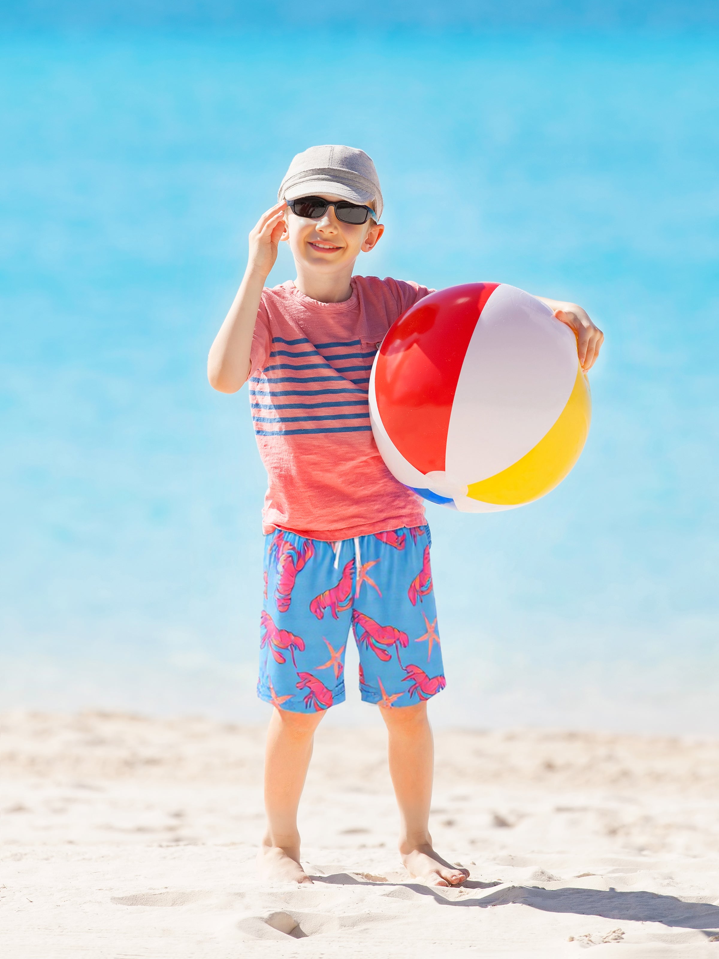 Active boy running in Surfcuz boys swim shorts — quick-dry, 4-way stretch, and perfect for sports, swimming, and summer adventures.